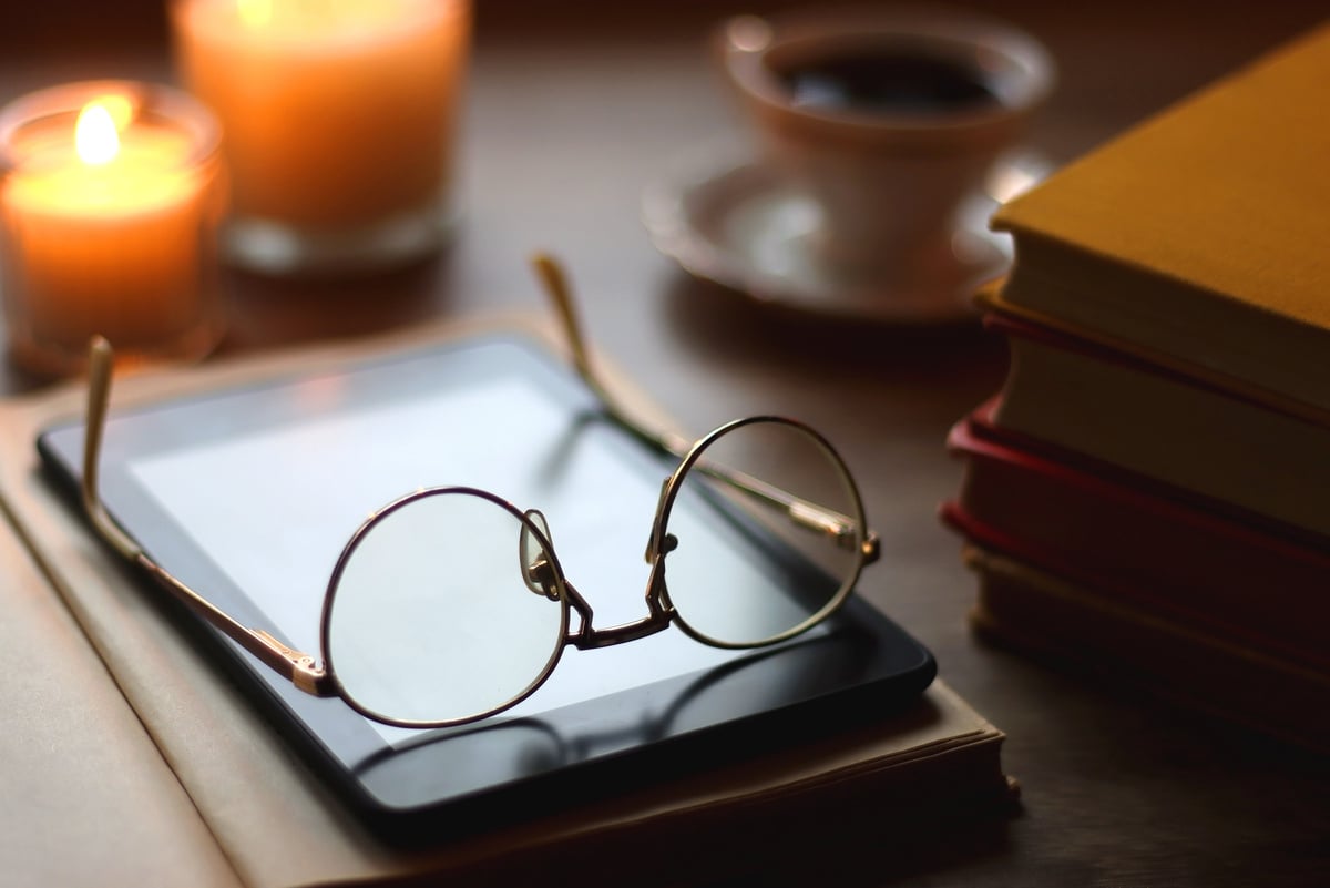 Books, Glasses, E-Reader, Pen, Tea, Cookies and Candles